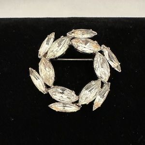 Vintage silver tone round brooch with clear marquis rhinestones